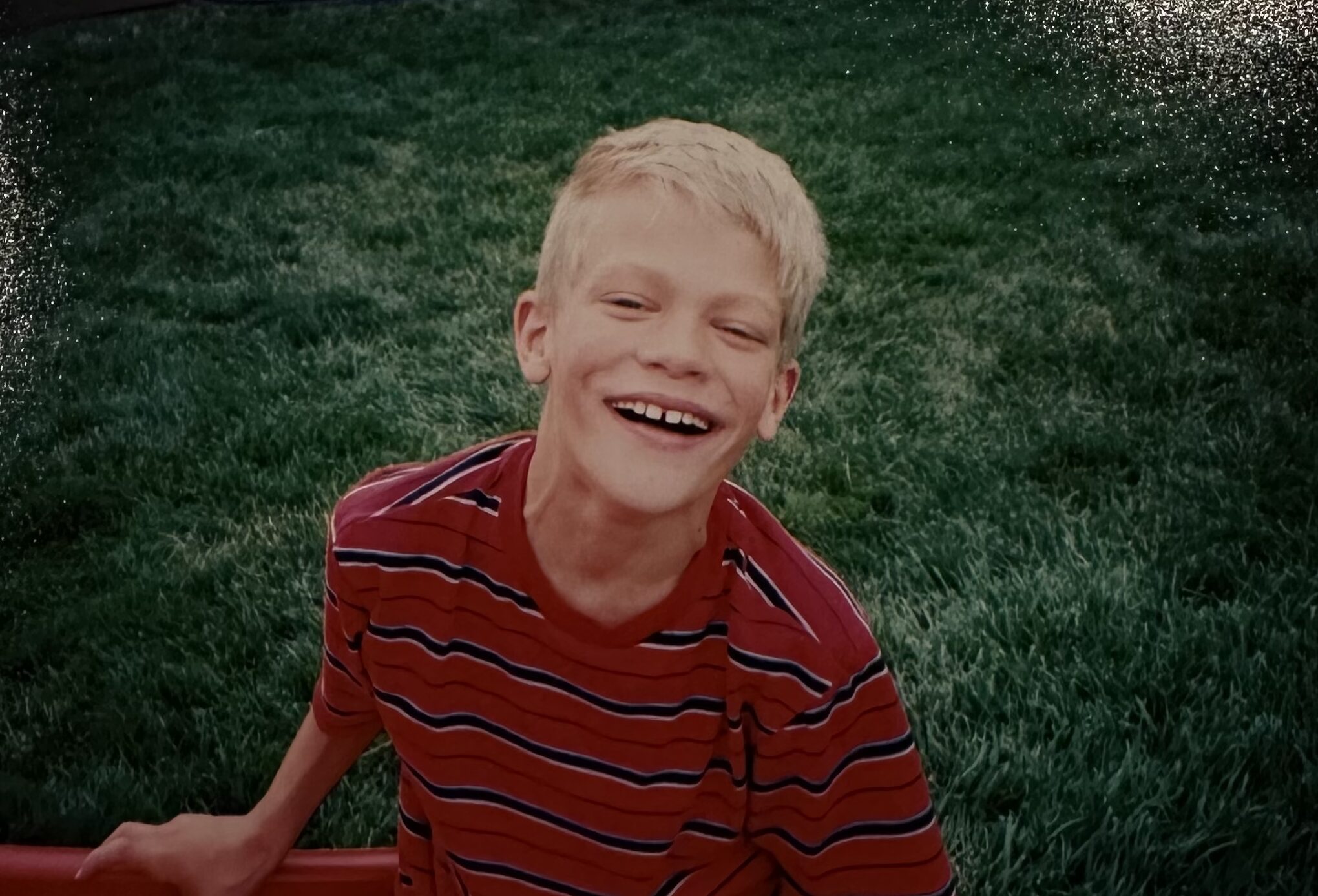 Brandon smiling during a nice summer day in the late 1990's