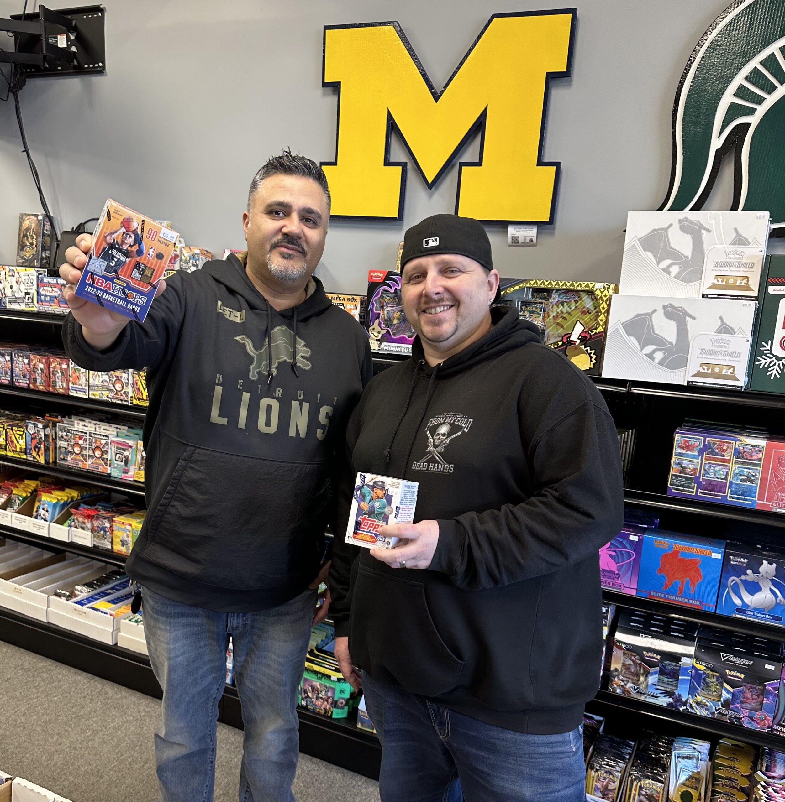 3 Kings Sports Cards owners Mike Khoury left and James Mathews hold samples of their products