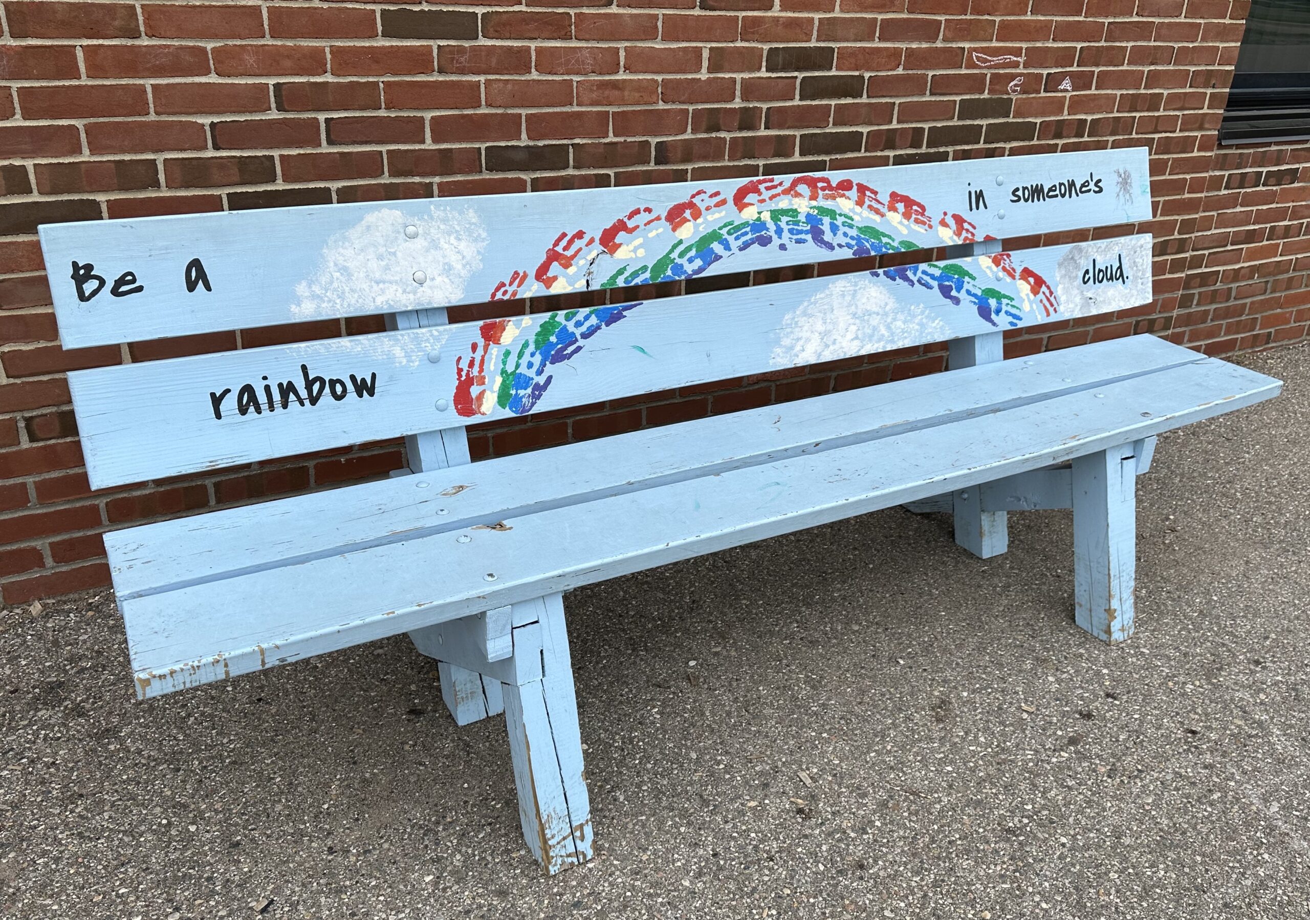 This Tonda Elementary School Buddy Bench is decorated with a cool phrase and artwork