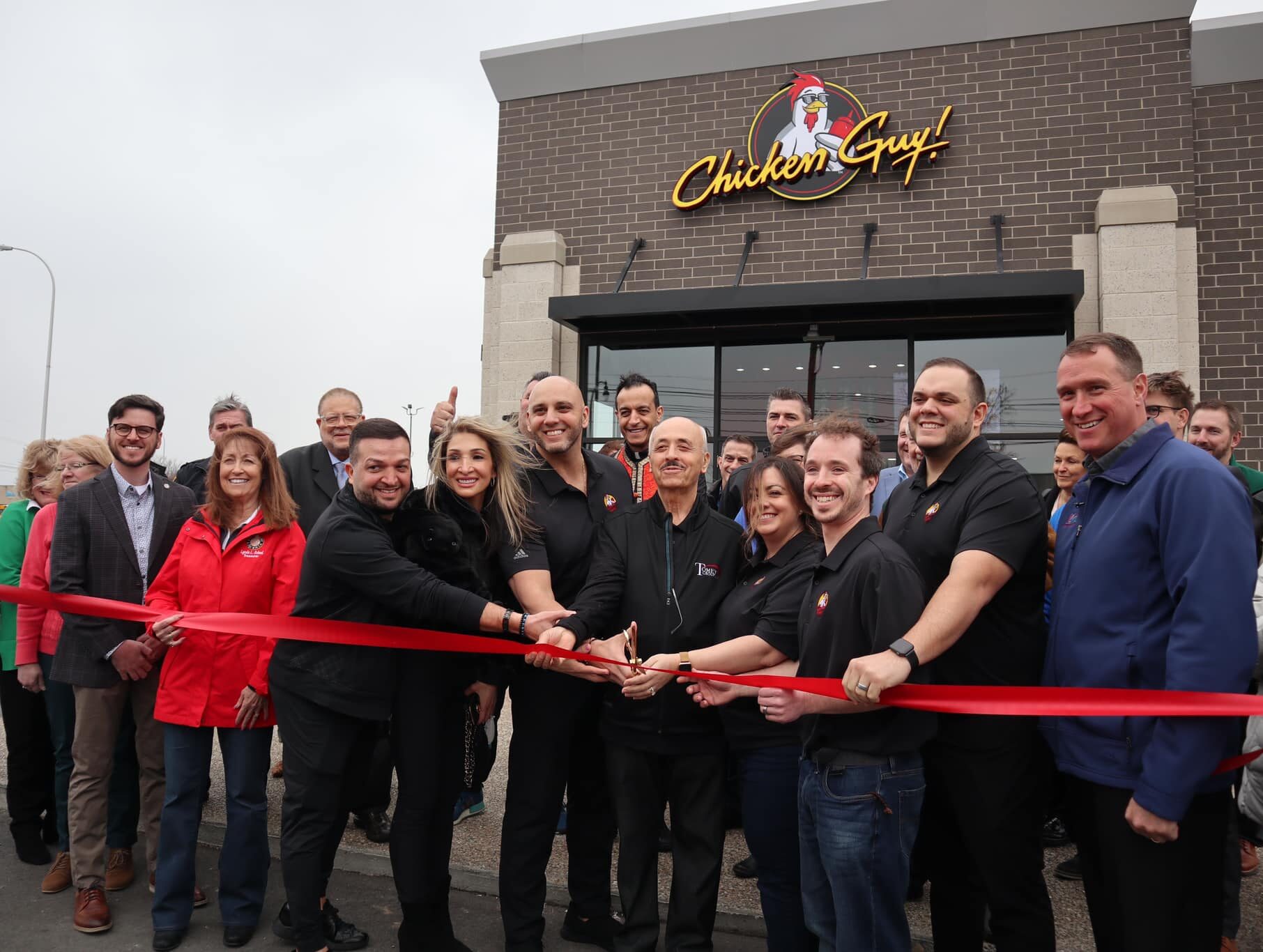 Members of The Tomey Group and the Livonia Chamber of Commerce are pictured during the Chicken Guy ribbon cutting ceremony