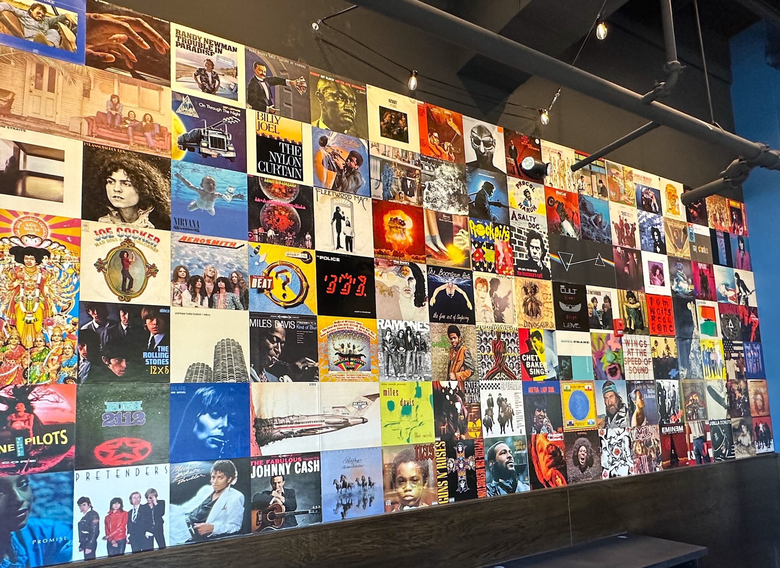 The northeast corner of the restaurant features a mural made up of iconic album covers