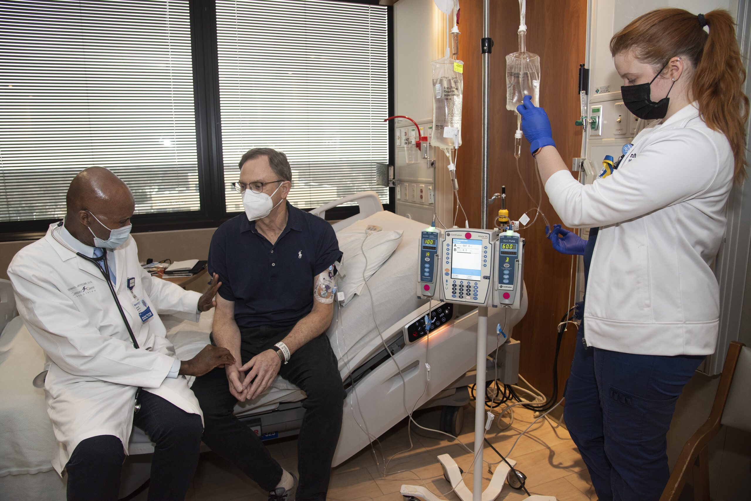Peter Grantz is examined by a Corewell Health doctor during an infusion