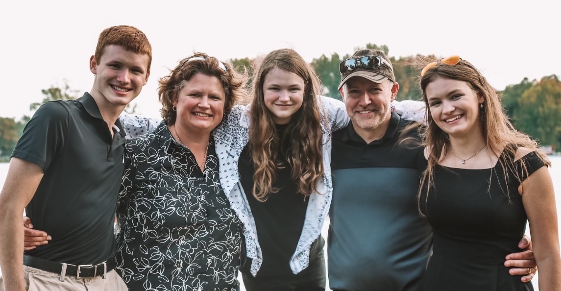 Cate Evans is pictured with her parents and siblings