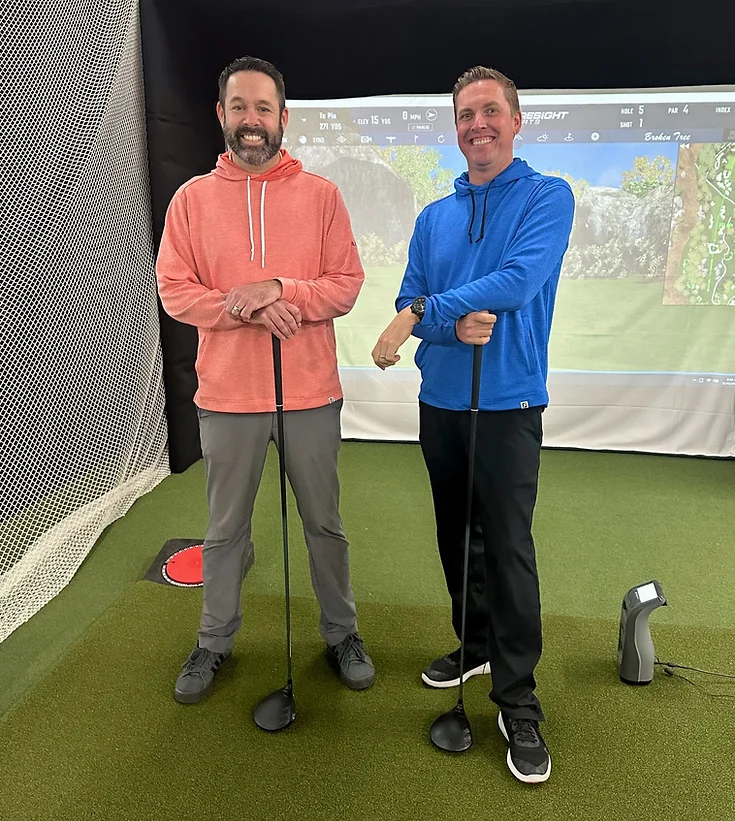 Golf Leadership Academy co founders Ben Bockin left and Chad Elledge stand in front of their four high tech simulators