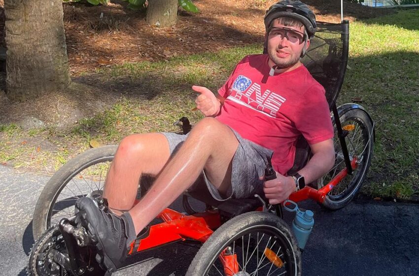 Jesse Lindlbauer is pictured taking a break in his recumbent bike