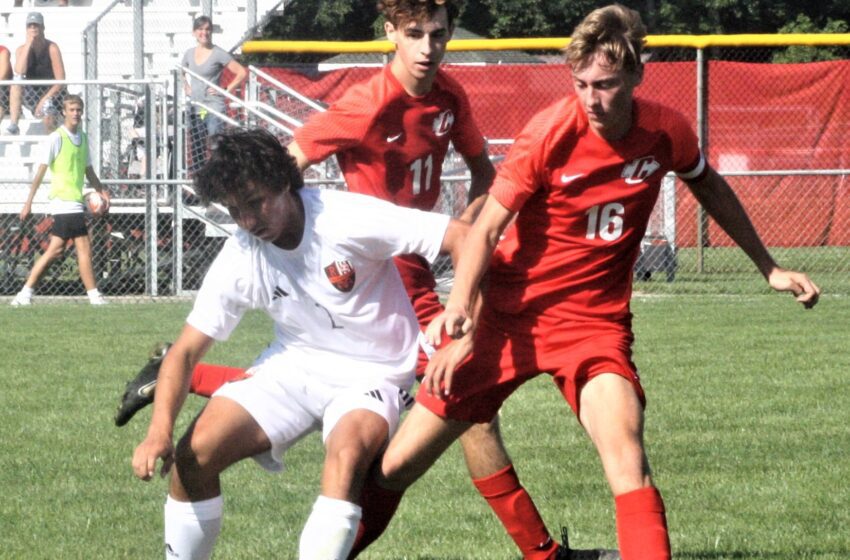Anthony Yono 16 and Alexander Bejczy defend a Rockford player Aug 19