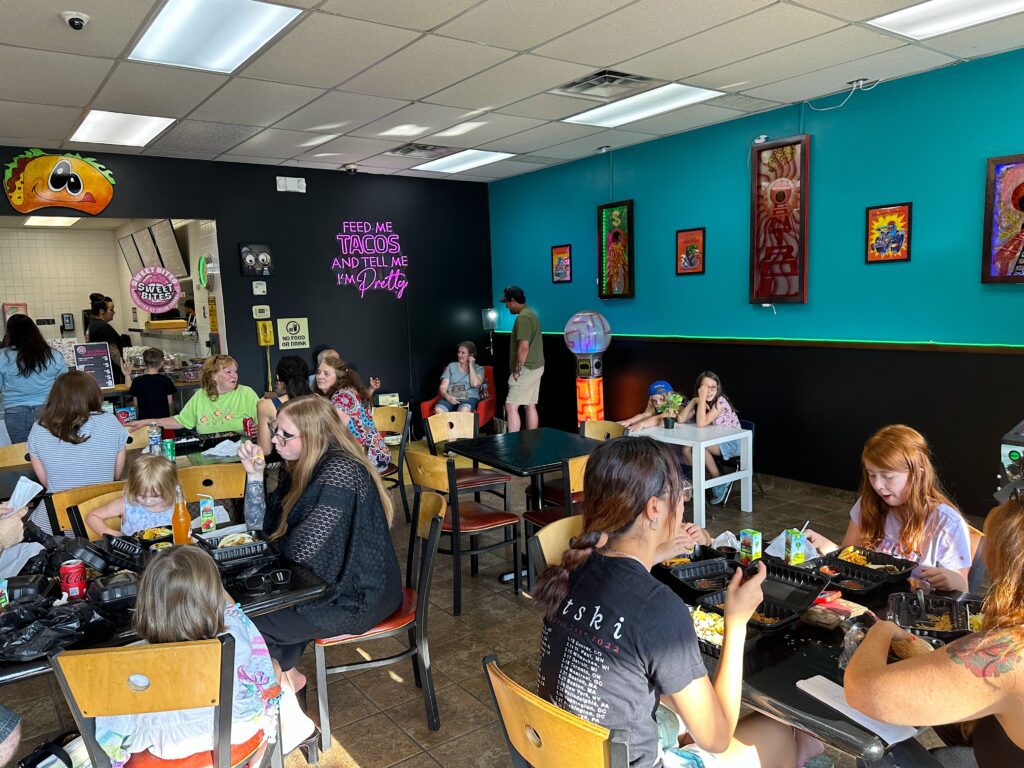 Invite only guests of Ruckus Taco Co and Sweet Bites owners Jeremy and Kara Kalmus enjoy the new eaterys cool vibe Wednesday afternoon